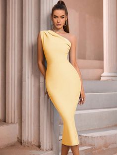 Step into a world of Sophisticated Elegance with our One-Shoulder Form-Fitting Bodycon Bandage Dress. This exquisite piece is the epitome of refined style, designed to accentuate your silhouette with its body-hugging bandage fabric. The one-shoulder design adds a modern, asymmetric twist to the classic bodycon, making it a standout choice for any upscale event. The zip-back feature not only ensures a snug fit but also adds an element of convenience. Whether you're attending a formal dinner, a cocktail party, or a high-profile event, this dress promises to make a statement. Its blend of sophistication and allure makes it a must-have for those who appreciate fashion that's both elegant and bold. Color: Black Style: Elegant Pattern Type: Plain Neckline: Asymmetrical Neck Sleeve Length: Sleeve Yellow Fitted One-shoulder Dress, Fitted Yellow One-shoulder Dress, Fitted One-shoulder Wedding Dress, Yellow Fitted One Shoulder Dress, Fitted One Shoulder Wedding Dress, Chic Fitted One-shoulder Dress For Banquet, Chic Fitted One Shoulder Dress For Banquet, Fitted One Shoulder Asymmetrical Dress For Gala, Fitted One Shoulder Evening Dress For Gala