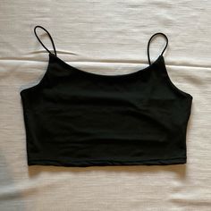 Spaghetti Strap Crop Top Size: Medium Color: Black Top Never Worn. Does Not Have Tags. Excellent Condition. Carefully Look At All The Pictures For Full Description! Black Summer Tops With Built-in Bra, Black Cami Top With Built-in Bra, Black Stretch Camisole With Spaghetti Straps, Black Seamless Camisole With Spaghetti Straps, Black Seamless Spaghetti Strap Camisole, Black Sleeveless Camisole With Adjustable Straps, Black Stretch Camisole For Summer, Black Seamless Sleeveless Crop Top, Black Tops With Built-in Bra For Summer