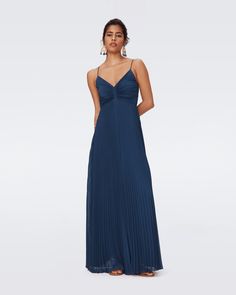 With a soft, light drape, the Ima maxi dress is a summer occasion go-to. This solid piece has spaghetti straps, a V-neckline, a pleated bodice, and a cinched waist.Cynthia is 5 Foot and 7 Inches and wearing a size 2. Navy Bridesmaids, Pleated Sleeves, Pleated Bodice, Maxi Dress Navy, Navy Blue Dresses, Cinched Waist, Soft Light, Von Furstenberg, Diane Von