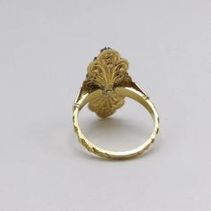 This is part of Chairish’s Fine Jewelry assortment.  A beautiful diamond cluster ring, made of 17 rose cut diamonds against a foil back, with a collet setting of sterling silver in an 18 karat yellow gold ornate band and mount. This ring is remarkable piece of Georgian revival jewellery, made between the 1930s and 1940s. The glimmering bouquet of gems are arranged in this way to form what epitomised the fashion of the Georgian era- the Rivière- a river of light, a flooding of pure, glowing diamo Georgian Cluster Ring, Baroque Rose Cut Diamond Jewelry For Wedding, Victorian Yellow Gold Cluster Ring With Diamond Cut, Victorian Cluster Ring In Yellow Gold With Diamond Cut, Ornate Baroque Jewelry With Rose Cut Diamonds, Antique 14k Gold Cluster Ring With Rose Cut Diamonds, Victorian 14k Gold Ring With Rose Cut Diamonds, Victorian 14k Gold Diamond Ring With Rose Cut Diamonds, Victorian Yellow Gold Rings With Rose Cut Diamonds