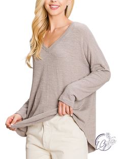 Casual v-neck long sleeve top. Features a drop shoulder for a relaxed look. Lightweight fabric makes this shirt easy to wear inside and outside the home. Fabric: 49% Polyester, 36% Cotton, 11% Acrylic, 4% Spandex Comfortable Relaxed Fit V-neck Top, Cozy Soft Texture V-neck Tops, Comfy Long Sleeve Soft-washed Top, Cozy Cotton V-neck Long Sleeve Sweater, Soft-washed Relaxed Fit V-neck Tops, Inside And Outside, Long Sleeve Top, Drop Shoulder, Lightweight Fabric