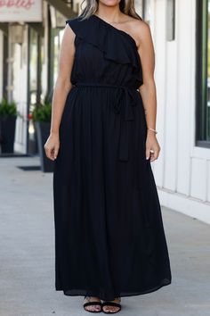 You'll look so fierce in this gorgeous dress! This dress has a beautiful black color with a flirty length and sleek material! This dress is perfect for any occasion, whether it is a plus on to a wedding or a fun holiday party! Style this dress with cute accessories and heels for a classy chic look! 100% Polyester Black Summer Maxi Dress For Prom, Black Maxi Dress For Summer Prom, Black Flowy Sleeveless Midi Dress, Black Flowy Sleeveless Dress, Flirty Flowy Maxi Dress For Date Night, Flowy Dresses For A Night Out, Flowy Solid Color Dress For Date Night, Black Flowy Maxi Dress For Prom, Spring Black Maxi Dress With Flattering Silhouette