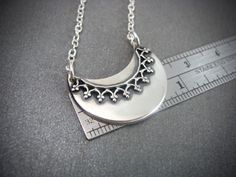 Silver Crescent Jewelry With Large Pendant, Handmade Silver Crescent Necklace, Elegant Crescent Jewelry With Oxidized Finish, Elegant Crescent Oxidized Jewelry, Silver Crescent Moon Charm Jewelry, Nickel Free Sterling Silver Crescent Necklace, Silver Half Moon Necklaces For Jewelry Making, Silver Half Moon Necklace For Jewelry Making, Gothic Silver Crescent Necklace