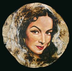 a painting of a woman's face on a plate