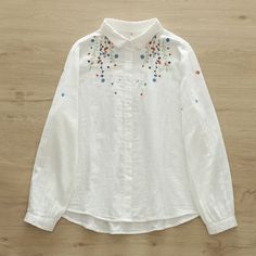 US$ 28.99 - Women's Ethnic Floral Shirts Embroidery Floral Shirts - m.zicopop.com White Cotton Shirt With Embroidered Cuffs, Spring Cotton Shirt With Resham Embroidery, Festive Cotton Shirt With Floral Embroidery, Cotton Blouse With Embroidered Cuffs, Cotton Long Sleeve Shirt With Intricate Embroidery, Long Sleeve Cotton Shirt With Intricate Embroidery, Casual Long Sleeve Tops With Resham Embroidery, Spring Long Sleeve Shirt With Resham Embroidery, Casual Cotton Shirt With Chikankari Embroidery