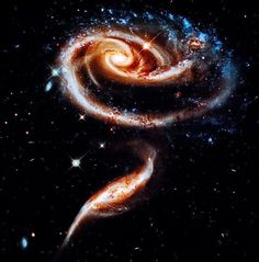 two spiral galaxy like objects in the sky