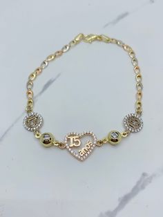 Style 1   ❤️ ❤️ ❤️ HEARTS ❤️ ❤️ ❤️  ❤️ Real 10k Gold Bracelet Sweet 15 -  15 Años with hearts  ❤️ 7.25" long bracelet and 1.3mm wide  ❤️ Yellow, rose, white gold with cubic zirconia  ❤️ Fine jewelry ❤️ Pulsera en oro de 10 Kilates De quinceañera  ❤️ 7.25 pulgadas de largo y 1.3 milímetros de ancho  ❤️ brasalete en oro sólido de 14k - oro rosado, blanco, dorado con corazones  ❤️ Guillo de 15 años con piedra zirconia SKU 053084 Style 2  ❤️ ❤️ ❤️ crosses  ❤️ ❤️ ❤️  ❤️ Real 10k Gold Bracelet Sweet 15 - 15 Años with crosses   ❤️ 7" long bracelet and 3mm wide  ❤️ Yellow, rose, white gold ❤️ Fine jewelry ❤️ Pulsera en oro de 10 Kilates De quinceañera  ❤️ 7 pulgadas de largo y 3milímetros de ancho  ❤️ brasalete en oro sólido de 10k - oro rosado, blanco, dorado con cruzes  ❤️ Guillo de 15 años  SKU 15 Quinceanera, Quince Stuff, Heart Real, Quinceanera Jewelry, Gold Arm Band, Long Bracelet, Gold Armband, Sweet 15, 15th Birthday