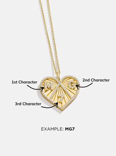 ​Start your own tradition with the Heart 18K Gold Custom Medallion Necklace. Available in two different sizes, this heart-shaped pendant features a beautiful border of sparkly Cubic Zirconia stones. Add three special numbers, letters, or a mix of both (single digit numbers only) - the options are endless. Better yet, this piece is crafted with 18K gold plated sterling silver, meaning it'll last you a lifetime. Heart Shaped Gold Sterling Silver Diamond Necklace, Gold Diamond Heart Necklace With Heart Charm, Heart-shaped Diamond Necklace In Gold, Gold Diamond Necklace With Open Heart Charm, Luxury Gold Diamond Necklace For Valentine's Day, Gold Double Heart Diamond Cut Necklace, Yellow Gold Heart Pendant Necklace With Diamonds, Gold Diamond Pendant Necklace With Heart Charm, Luxury Gold Heart Pendant Diamond Necklace