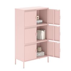 a pink bookcase with two doors open and books on the bottom shelf next to it