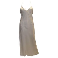 Check out this item from 1stdibs! Ivory Silk Slip : https://www.1stdibs.com/id-v_8024872 Cream V-neck Slip Dress For Party, Formal V-neck Slip Dress With Delicate Straps, V-neck Slip Dress With Delicate Straps For Wedding, Chic V-neck Slip Dress For Wedding Night, Elegant Backless Satin Camisole, Chic White V-neck Slip Dress, Elegant Cream Slip Dress For Daywear, Formal V-neck Bias Cut Slip Dress, White V-neck Slip Dress For Daywear