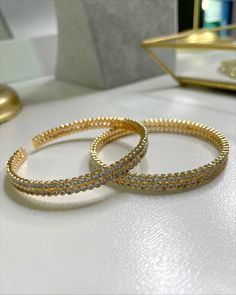 Wrapped in elegance and timelessness, this gold filled Zircon bracelet boasts perfection in its beautiful design. With its unique shimmer and delicate look, this bracelet will surely make all of your outfits look perfect. Elegant Tarnish-resistant Tennis Bracelet For Weddings, Elegant Adjustable Gold Plated Bangle, Elegant Gold-plated Bangle Bracelet, Elegant Gold Plated Bangle Bracelet, Classic Gold Bracelet For Party, Elegant Gold-plated Tarnish-resistant Tennis Bracelet, Elegant Gold Plated Tennis Bracelet, Tarnish Resistant, Elegant Gold Cuff Bracelet With Round Shape, Elegant Gold Round Cuff Bracelet