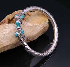 "925 sterling silver handmade vintage design amazing turquoise stone open face bangle bracelet kada unisex jewelry from Rajasthan india. Metal-925 Sterling silver. Brand-traditional-jewellery. Inner diameter-5.7 cm Size-2.25\" or 2-4 easily wearable by twisting it(easily wearable by greater size) Weight-25.270 grams approx width-7 mm approx. Marking-925. Stone- Blue turquoise stone. Makes excellent gifting and collectible pieces" Festival Oxidized Bangle Jewelry, Handmade Silver Bangle Jewelry, Sterling Silver Temple Jewelry Bracelet, Oxidized Finish Bangle For Festivals, Silver Bangle For Festivals, Oxidized Metal Toe Ring Jewelry, Silver Ceremonial Bangle Jewelry, Silver Toe Ring Jewelry, Hand Set, Spiritual Metal Bracelet Jewelry