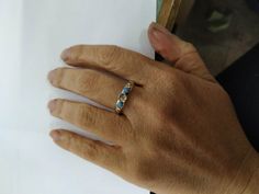 Recycled Silver and 14k Gold With blue and white Opal ring (The listing is only for the ring with the stone) If you want it with the secend ring: https://www.etsy.com/listing/155717400/gold-ring-wedding-bands-stackable-rings?ref=shop_home_active_52 You are looking at a beautiful HAND MADE silver and 14k gold ring with lovely blue opal. The opal stone is setting in 14k gold bazel. It is impressive, powerful and very beautiful ring. Size blue opal is 6mm White opal are 3 mm Custom rings are availa Adjustable Multi-stone Opal Ring For Anniversary, Gift Yellow Gold Multi-stone Opal Ring, Gift Multi-stone Opal Ring In Yellow Gold, Unique Opal Ring With Bezel Setting For Anniversary, Fine Jewelry Hallmarked Opal Ring Gift, Blue Opal Ring With Bezel Setting For Gift, Adjustable Opal Ring For Anniversary With Stone Setting, Heirloom Hallmarked Opal Ring Gift, Gold Opal Ring With Stone Setting For Anniversary