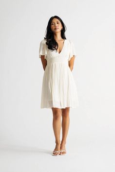 "The Sun Is Out And It'S Time To Have Some Fun! Throw On Our Out Of Time Cream V-Neck Pintuck Pleated Dress And Head Out The Door. This Skater Dress Is Perfect For A Day Of Exploring. With A Pleated Skirt And V Neckline, This Dress Is Both Flattering And Comfortable. The Short Sleeves And Flowy Silhouette Make It Perfect For A Hot Summer Day. Whether You'Re Headed To The Beach Or The Park, This Dress Is Sure To Keep You Feeling Cool And Looking Cute." Out Of Time, Pleated Mini Dress, Cream Dress, Pin Tucks, Summer Day, Pleated Dress, Skater Dress, The Door, Hot Summer