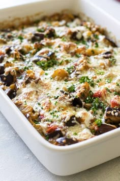 a casserole dish with mushrooms and cheese