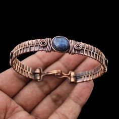 Lapis Lazuli Cuff Bracelet Copper Wire Wrapped Bangle Cuff Adjustable Bangle Gemstone Bracelet Handmade Bangle Copper Bangle Lapis Jewelry Main Stone - Lapis Lazuli Bangle Length - 2.50 - 2.75" Inches (Adjustable) Bangle Width  -  0.50 Inches Metal                  -  Copper Copper Has Been Used For Jewelry Making For Thousands Of Years, Dating Back To Ancient Civilisations Such As The Egyptians, Romans, And Aztecs. Copper Was Valued For Its Beauty, Versatility, And Durability, And Was Often Use Ancient Civilisations, Lapis Jewelry, Wire Wrapped Bangles, Handmade Bangles, Adjustable Bangle, Bracelet Handmade, Copper Jewelry, Gemstone Bracelet, Copper Wire