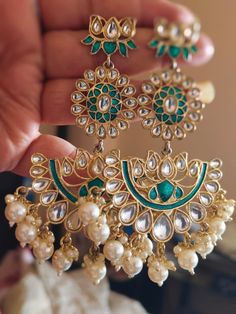 Polki Earrings Sabyasachi Inspired Jewelry Kundan Earrings Uncut Polki Jewelry Chandbali Earrings Moissanite Polki Emerald Green Earrings Add a touch of elegance to your ensemble with our stunning golden earrings adorned with green pearls and white Kundan, accented with intricate mirror work. These handcrafted earrings exude traditional charm and sophistication, perfect for elevating your ethnic look. Whether you're attending a wedding, festival, or special occasion, these earrings will make a statement and capture attention with their unique design. Made with high-quality materials, our Kundan earrings are designed to be both stylish and durable, ensuring they become cherished pieces in your jewelry collection. Embrace the beauty of Indian craftsmanship with these exquisite ethnic earring Luxury Round Kundan Jhumkas, Luxury Traditional Kundan Jhumkas, Luxury Bollywood Latkans Earrings, Luxury Kundan Bridal Earrings For Celebration, Cheap Chandbali Bridal Earrings For Party, Luxury Fusion Bridal Earrings For Diwali, Elegant Luxury Earrings For Navratri, Luxury Kundan Jhumkas With Zari Work, Indian Bridesmaids Earrings