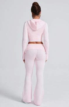 Elevate your off duty wardrobe with the Portia Knit Hoodie. This cropped hoodie features a fitted silhouette with a 2-way zipper and drawstring for the perfect fit. Complete your look with the matching Portia knit Pants.



Colour: Pink.

Cropped length.

Unlined.

Fitted.

Fitted sleeves with wide 2x2 rib cuff.

2-way functional exposed zipper down centre front.

2x2 rib hem.

Front drawstring.

Model is an XS and is wearing an XS.

 Size: XS, S, M, L, XL, XXL Unique Loungewear, Pink Polo Set, Light Pink Nike Hoodie, Dancing With The Stars Outfits, Bummy Outfits Baddie, Period Fits, New Stuff, Off The Shoulder Hoodie, Pink Valentines Day Outfit