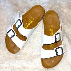 Gorgeous Winter White Birkenstock Arizona Sandals Are Made In Germany Using Leather Uppers With A Cork Footbed. These Sandals Are Narrow Fit For Amazing Fit And Comfort. Can Be Worn With Socks Or Without! Almost Unworn. White Footbed Sandals With Ortholite Insole For Summer, White Flat Sandals With Ortholite Insole, White Sandals With Ortholite Insole And Flat Heel, White Ortholite Footbed Sandals For Summer, White Open Toe Footbed Sandals With Ortholite Insole, Vacation Leather Footbed Sandals With Round Toe, White Sandals With Ortholite Insole For The Beach, White Buckle Closure Flip Flops With Round Toe, White Buckle Closure Round Toe Flip Flops