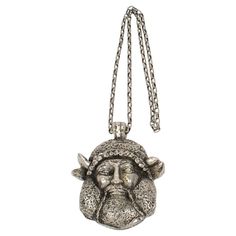 This stunning Guy Laroche Paris signed pendant necklace features an extra-long silvered metal textured chain with a massive dimensional pendant. The medallion boasts an antique Viking god face in silvered metal-coated resin. The engraved signature on the pendant's edge reads Guy Laroche Paris. There is no closing clasp. Measurements: The necklace's total length is 27.56 in (70 cm) - The drop is 17.75 in long (45 cm) - The medallion is 3.75 in wide (9.5 cm) x 4.29 in high (10.9 cm) x 1 in deep (2 Guy Laroche, Metal Texture, Medallion Necklace, The Drop, Vikings, Metallic Silver, Jewelry Necklace Pendant, Metallica, Jewelry Necklaces