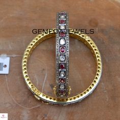 Polki Diamond Silver Bangle, Red Ruby Gemstone Bangle, 925 Sterling Silver Jewelry, Openable Bangle Bracelet, Wedding Gift, Gift For her Gross Weight: 29.59 gram Gemstone Weight: 8.91 cts Polki Diamond Weight: 1.52 cts Pave Diamond Weight: 2.44 cts Bangle Size: 63X63 MM NOTE:- All The Products Are Designed And Manufactured In My Workshop By Me & My Team. Shown Products Are Purely Handmade. Custom Orders Are Open Handly Accepted. We Are Perfect Choice For Any Custom Jewelry Manufacturing. For Silver Temple Jewelry Bracelets For Wedding, Luxury Stackable Ruby Jewelry, Multi-stone Diamond Bangle Bracelet Gift, Exquisite Bangle Bracelets For Anniversary, Elegant Multi-stone Bangle For Anniversary, Red Ruby Bangle As Gift, Red Ruby Round Bracelets, Red Ruby Round Bracelet, Red Ruby Bracelets