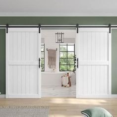 a room with green walls and white sliding doors