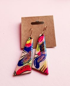 These earrings are sure to get attention, they are one of a kind and hand painted! They are bright and colorful making them easy to find something to match them! They are light weight despite their size, they have a wooden base and are sealed to last with high quality UV resin! They are also made using 14kt gold filled ear wires to ensure they are kind to even sensitive ears! All earrings come with their own jewelry polishing cloth!Each order is ships with USPS and a tracking # 💜 CARE INSTRUCTIONS 💜 Resin can be cleaned with soap and water. Your jewelry should be stored in an airtight bag or jewelry box that is in a cool, dry environment to protect from oxidation 💌 Please contact me with any questions.💌 ❣️ I do my best to ensure a quick and timely response! ❣️ Artistic Hand Painted Pink Earrings, Multicolor Hand Painted Fun Earrings, Fun Multicolor Hand Painted Earrings, Colorful Hand-painted Drop Earrings, Fun Hand-painted Pink Earrings, Colorful Hand Painted Drop Earrings, Fun Hand Painted Pink Earrings, Fun Yellow Hand Painted Earrings, Colorful Hand Painted Earrings As Gift