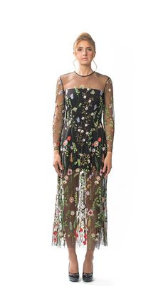 Sheer Embroidered Floral Long Column Dress with Long Sleeves and Attached Black Lining.  Dress has slightly flared hemline and Centre-back invisible zipper closure.  Dry Clean Only. All dresses are individually-made in Vancouver, Canada.  Dresses ship within 2 weeks of an order being placed. Fabric is 100% Polyester Embroidered Tulle.  Lining is 95% Polyester/5% Spandex. Dress is available in four sizes: XSMALL, SMALL, MEDIUM, and LARGE. Model is 5'10, 125lbs, and is wearing a size SMALL. X-SMAL Fall Party Embroidered Floral Dress, Long Sleeve Dress With Floral Embroidery For Cocktail, Long Sleeve Floral Embroidery Cocktail Dresses, Fitted Long-sleeve Embroidered Dress With Floral Applique, Long Sleeve Embroidered Dress With Floral Details For Evening, Fitted Long Sleeve Embroidered Dress With Floral Applique, Multicolor Embroidered Long Sleeve Embellished Dress, Fall Cocktail Dress With Embroidery, Embellished Long Sleeve Dress With Multicolor Embroidery