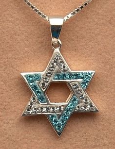 Magen David Star Of David Pendant Blue & Crystal Gemstone Sterling Silver 925come with sterling Silver 925 neck chain 45 cm long & box Dimensions: 1.9 cm height x 1.9 cm width weight 3.8 grams / 0.14 Oz Welcome to Spring Nahal! All packages sent direct from our store in Ben Yehuda St, Tel Aviv, Israel. Lets talk about Shipping: You can choose between two shipping method: Standard Shipping - Ships within 14 - 28 days. Expedited Shipping - Ships within 5 - 10 days. All orders are approved with tra Bible Jewelry, Spring Perfume, Star Of, David Star, Christian Bracelets, Star Of David Pendant, Lets Talk, Roman Glass, 28 Days