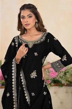 Black Chinon Embroidered Palazzo Style Suit, features detailed golden thread and zari work, making it a must-have for any festive or traditional event. Its stylish and elegant design will surely capture attention and make you stand out. Fabric: chinon silk Work: embroidered, zari work, sequins Dupatta: embroidered chinon silk Top length: 38" Bottom length: 39" Sleeves length: 20" Dupatta size: 2 meter, width 34" Pull-on style elastic waist pants with flat front waist band Shirt with Invisible si Traditional Palazzo Set With Gold Embroidery For Festivals, Traditional Palazzo Set With Gold Embroidery For Eid, Traditional Gold Embroidery Palazzo Set For Festive, Traditional Gold Embroidery Palazzo Set For Festive Occasions, Festive Palazzo Set With Gold Embroidery For Eid, Unstitched Palazzo Set With Gold Embroidery For Festivals, Festival Unstitched Palazzo Set With Gold Embroidery, Diwali Straight Kurta Set With Gold Embroidery, Unstitched Sets With Gold Embroidery