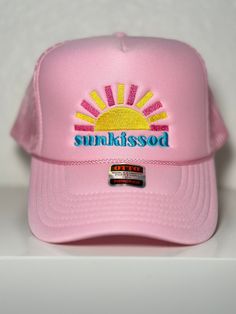 Embroidered "Sunkissed" Pink Trucker Hat Adjustable Flat Brim Trucker Hat For Summer, Spring Beach Trucker Hat With Flat Brim, Summer Baseball Cap With Embroidered Logo And Flat Brim, Adjustable Beach Baseball Cap With Embroidered Logo, Trendy Snapback Hat With Curved Brim For Beach Season, Beach Trucker Hat With Embroidered Logo And Curved Brim, Summer Beach Dad Hat With Embroidered Logo, Trucker Hat With Embroidered Logo For Beach, Summer Snapback Baseball Cap With Uv Protection