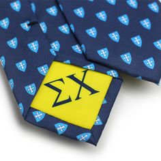 a blue and yellow tie with an x on the front in black, white and blue