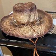 Nwt Western Boho Coastal Cowgirl Wide Brim Cowboy Hat Trimmed With Tassel, Braided And Jeweled Hat Band Wired Brim Making It Reshapable Adjustable Chin Strap Cord Holds The Hat In Place For Windy Days; Interior Adjustable Hat Band Woven Straw Color: Brown Brim 3.5” Hat Size 57 Cm Non-Smoking Home Wild West Boho Coastal Cowgirl Western Chic Bohemian Shabby Chic Beach Summer Sun Hat Brown Straw Hat For Rodeo, Trendy Brown Straw Hat For Festivals, Western Brown Hat For Beach Season, Brown Country Style Straw Hat For The Beach, Brown Country Style Straw Hat For Beach, Brown Sun Hat For Beach Season And Country Events, Brown Sun Hat For Country Events And Beach Season, Brown Western Style Sun Hat For Vacation, Brown Summer Sun Hat For Rodeo