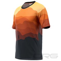 an orange and black t - shirt with mountains in the background on a white background