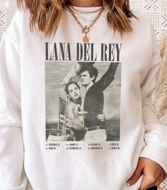 Lana Del Rey Vintage Music Sweatshirt White Screen Print Band Merch Sweatshirt, White Letter Print Sweatshirt For Concert, White Band Merch Sweatshirt, White T-shirt For Concerts In Fall, White T-shirt For Fall Concert, White Band Merch Sweatshirt For Concerts, Lana Del Rey Sweatshirt, Lana Del Rey Merch, Lana Del Rey Vintage