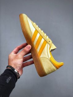 Originally designed for indoor sports, the Adidas Handball sneaker is now a streetwear classic, offering both performance and style. Adidas Handball, Indoor Sports, How To Measure, Go Up, Good Grips, Luxury Shoes, Adidas Shoes, Adidas Originals, Tights