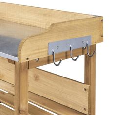 a wooden bed frame with two metal hooks on the top and bottom bars attached to it