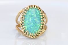 GREEN OPAL RING, Opal Gold Ring, Gemstone ring, October Birthstone, Opal Emerald lawn Gold Filled Ring, Fire Opal jewelry, Opal Big Ring Statement green opal ring made of 14k gold filled the stone is 13*18 mm , it is a perfect to give as a gift for woman Measurements: Size- available all size The center stone is 18mmx13mm Gemstone is a lab opal The ring will be packed in a gift box. FOR MY RINGS COLLECTION HERE: https://www.etsy.com/il-en/shop/rebekajewelry?section_id=14282915&ref=shopsectio Elegant Green Opal Oval Ring, Unique Green Emerald Ring With Gemstone Accents, Oval Green Emerald Ring With Gemstone Accents, Green Oval Opal Ring For Formal Occasions, Green Opal Cabochon Ring, Green Opal Ring As A Gift, Green Opal Ring For Anniversary, Fine Jewelry Green Opal Ring, Green Opal Ring For May Birthstone Gift