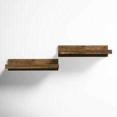 two wooden shelves on the wall with white background