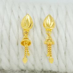 Celebrate the essence of Indian heritage with these radiant 22k gold earrings. Each earring is meticulously designed with traditional patterns that catch the light and add a regal touch to your look. Perfect for both festive occasions and elegant evenings, these earrings are a testament to the rich history of Indian jewelry, offering a blend of classic beauty and modern sophistication. 22k gold earrings handmade jewelry made in India Metal is Real Gold Not Filled or Not Gold Plated Metal - Yello Gift Yellow 22k Gold Earrings, 22k Gold Earrings With Latkans For Gift, Yellow 22k Gold Dangle Earrings, Gold Teardrop Danglers As A Gift, Yellow Gold Danglers For Gift, Gold Teardrop Danglers For Gift, Gold Teardrop Danglers For Anniversary, Gift Yellow Gold Danglers, Gold Latkans Earrings For Anniversary