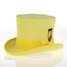 This distinguished and elegant classic formal top hat will add timeless style to any outfit. Constructed of 100 percent wool felt, this hat is finished with grosgrain ribbon trim and has a fully lined plush interior. Features: 100% Wool Felt Reinforced Brim & Crown for ultimate longevity Grosgrain Ribbon & Feather Accent Crown: 7 inches high Brim: 2 inches Ribbon Feather, Formal Top, Instagram Men, Formal Tops, Ribbon Trim, Wool Dress, Dress Top, Top Hat, Top Dress