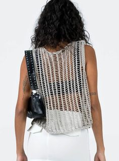 Show off your trendsetter style in this allery crochet knit sleeveless tank. Crafted from lightweight, airy fabric, this stylish tank is perfect for all your summer looks. It's the perfect companion for your shorts, jeans, and skirts! (And yeah, you look totally hot in it). Size Guide: Model is 5’5” tall, and has a 33.1” bust, 24.6”waist, & 37.2” hips. She is wearing a S / US 4 / AU 8. This tank is true to size. Material: 100% Acrylic. Key Features: Relaxed fit. Pull-on. Crochet Knit Fabrication