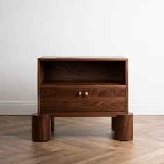 a wooden table with two drawers on one end