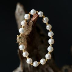 This beautiful Freshwater pearl bracelet ranges between 7-8mm in size and consists of beautiful and lustrous pearls in AAAA+ quality. All pearls in this bracelet are round and are strung with silk thread and double-knotted between each pearl. Known as the 'icon' of cultured pearls, Freshwater pearls have graced the necks, ears, fingers, and wrists of women for decades. Huge Tomato imports their Freshwater pearls from the Freshwater rs of Japan, grown in the Pinctada fucata oyster. All of our Fre Round Pearl Bracelet With 8mm Beads, 8mm Round Pearl Bracelet, 8mm Pearl Beads Bracelet, Pearl Bracelet With 8mm Beads, Pearl White Pearl Bracelet With 8mm Beads, Akoya Pearl Bracelet With Round Pearl Drop Beads, Akoya Pearl Charm Bracelet With Round Beads, Akoya Pearl Drop Bracelet With Round Beads, Akoya Pearl Bracelet With Pearl Drop