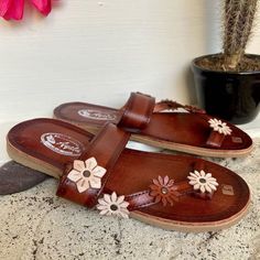 Beautiful handmade Huaraches. They are the best quality that can be found in huaraches. They are completely handmade, making them totally unique in style. These beautiful shoes can be worn with a dress as well as with a pair of jeans and you will look unique and fashionable. How to order your size: Example, if you wear size 6.5 ask for size 6. If you wear size 6 ask for 6. The huarache molds to your feet with use, they stretch. Note: Size changes are accepted. If you need a change in numbering, Brown Huarache Sandals With Rubber Sole For Beach, Artisan Huarache Sandals For Spring, Artisan Sandals With Rubber Sole For Summer, Traditional Leather Sole Flip Flops For Beach, Artisan Open Toe Sandals In Natural Color, Natural Huarache Sandals With Rubber Sole For Beach, Artisan Huarache Sandals For Summer Vacation, Artisan Sandals With Rubber Sole For Festival, Beach Huaraches With Leather Sole In Natural Color