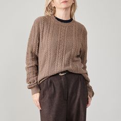 "Step into winter elegance with our Vintage Brown Alpaca Wool Crew Neck Sweater. This Women's L-XL sweater boasts a timeless cable knit design, expertly crafted from a sumptuous 75% alpaca blend. The earthy tone exudes sophistication, offering a versatile choice that effortlessly transitions from the office to winter holidays. Immerse yourself in the warmth and comfort of this super-cozy sweater, a harmonious blend of style and functionality. Its versatile design adapts to various occasions, ensuring you remain chic and snug all season long. Notably long, it caters perfectly to tall women, enhancing the sweater's overall appeal. Composition: 75% alpaca, 25% polyamide Condition: excellent Size on tag: 50 Precise measurements of the brown sweater while lying flat: Armpit to armpit: 59 cm | 2 Cheap Classic Brown Sweater, Luxury Brown Sweater With Relaxed Fit, Affordable Vintage Brown Sweater, Winter Office Outfit, Winter Office, Winter Pants, Wool Clothing, Cable Knit Jumper, Crew Neck Jumper