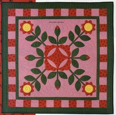 the cover of pennsylvania reef quilt pattern is shown in red and green plaid with flowers on it