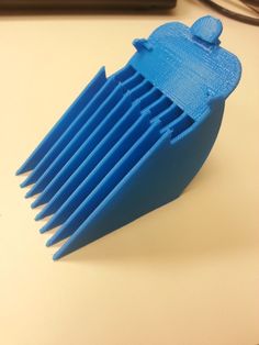 a blue comb sitting on top of a table