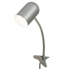 a metal desk lamp with a white light on it's side and a black cord attached to the arm