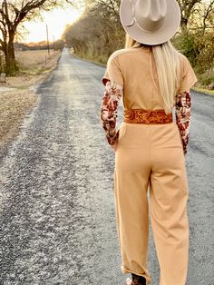 Loving this super soft and subtle one piece jumpsuit!! Soft cotton material, short sleeves and buttons up the front. Pockets at the hips. True to size with a relaxed fit. You can cuff the pant leg to wear with booties or wear them uncuffed as well!!! So cute and comfy to wear it dressed up or keep it casual!!! model is shown wearing a small and is a 2/4, 5'6" tall and 34C bust 32” inseam poly blend Relaxed Fit Brown Jumpsuits And Rompers For Fall, Brown Short Sleeve Jumpsuits For Work, Beige Cotton Jumpsuits And Rompers For Fall, Brown Short Sleeve Jumpsuits And Rompers For Spring, Beige Short Sleeve Jumpsuits And Rompers For Spring, Beige Relaxed Fit Jumpsuits And Rompers For Fall, Short Sleeve Cotton Jumpsuits And Rompers For Fall, Cotton Short Sleeve Jumpsuits And Rompers For Fall, Fitted Short Sleeve Jumpsuits For Fall